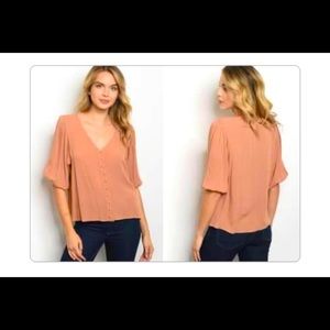 Tan V-neck front-button elbow sleeve top.